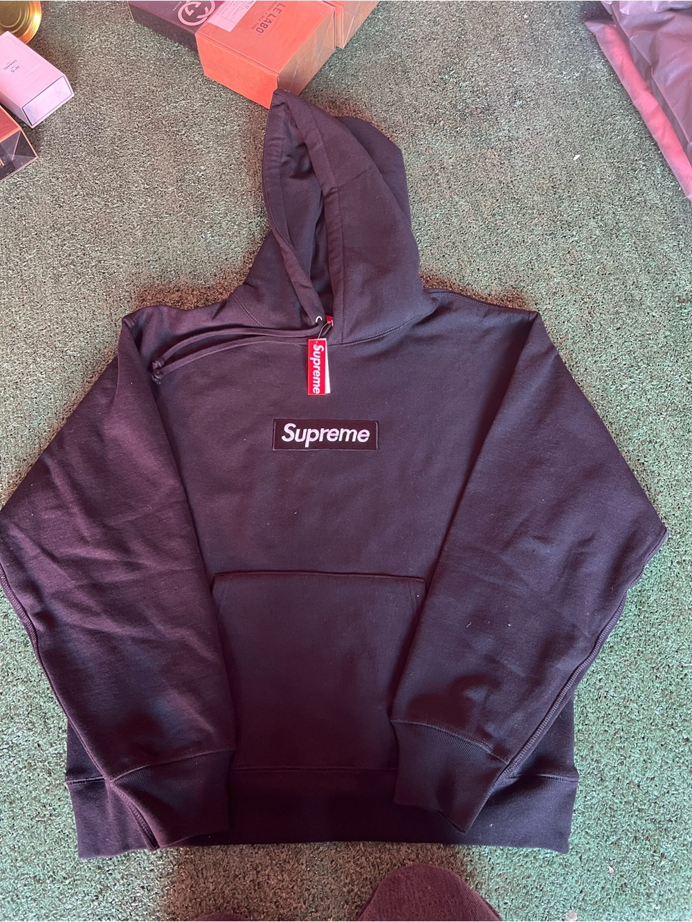 Supreme Black Pullover Hoodie with Red Tag
